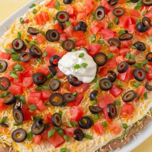 The BEST 7 Layer Dip Recipe • MidgetMomma