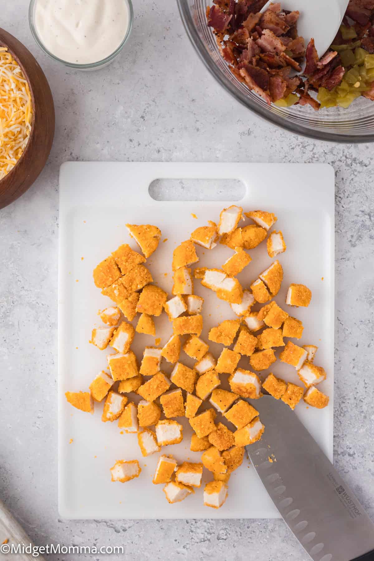 chopped chicken on a cutting board. 