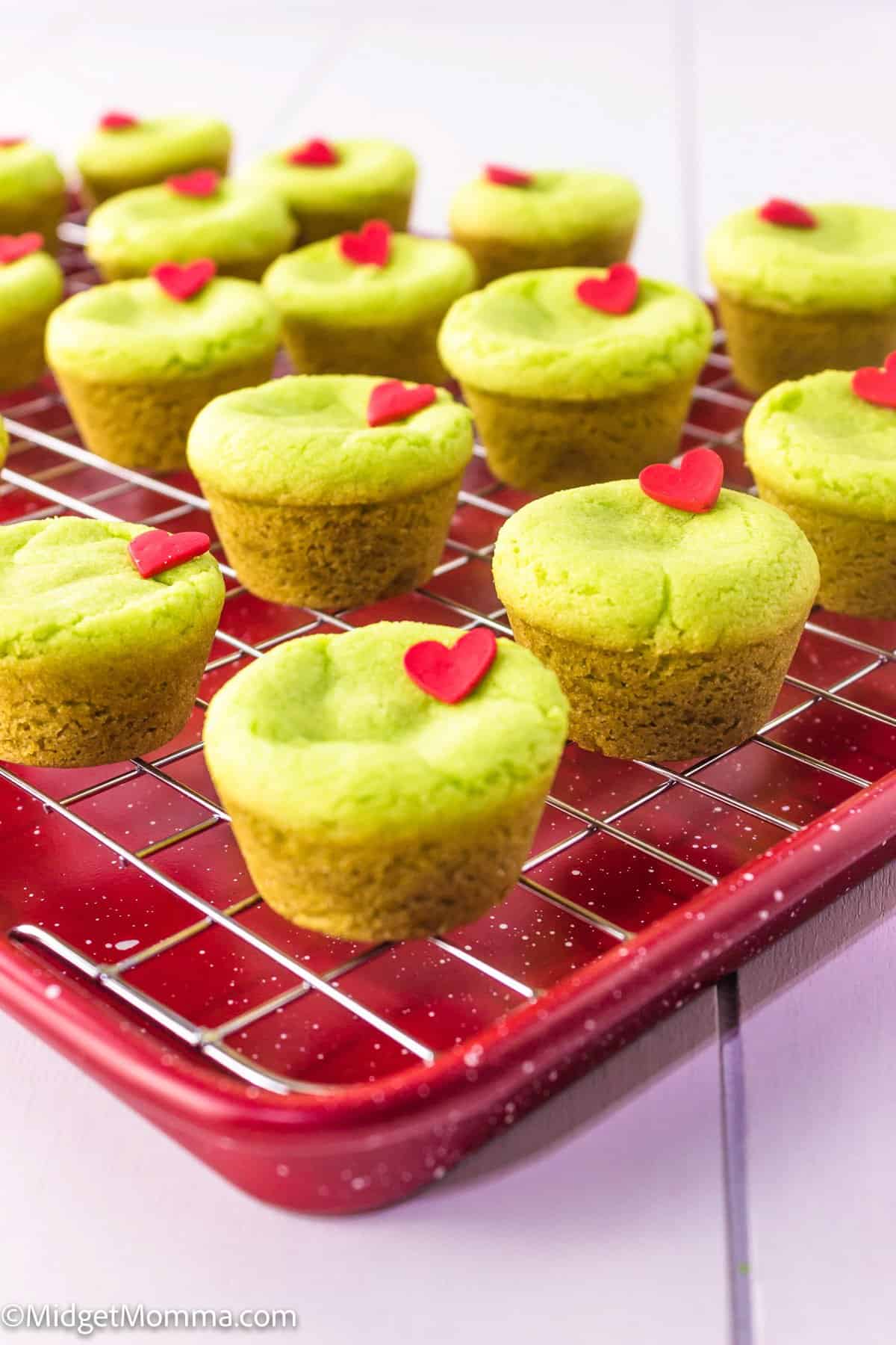 Stuffed grinch cookies on a cooling rack