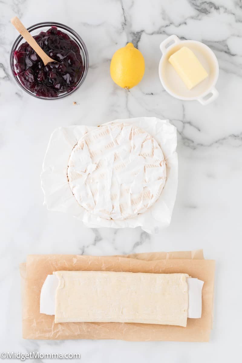 Baked Brie in Puff Pastry with Blueberry Pie Filling Recipe • MidgetMomma