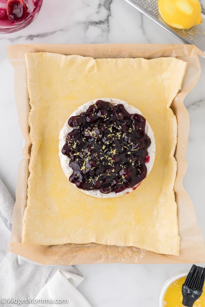 Baked Brie in Puff Pastry with Blueberry Pie Filling Recipe • MidgetMomma