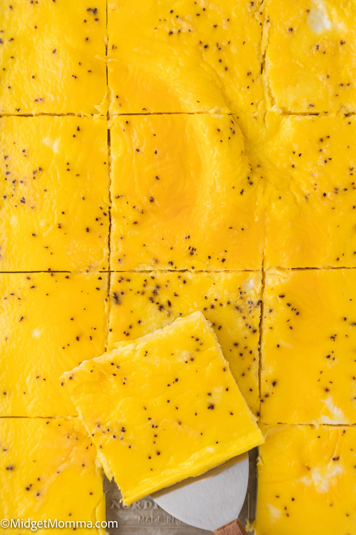 sheet pan scrambled eggs in a baking dish cut into 12 portions.