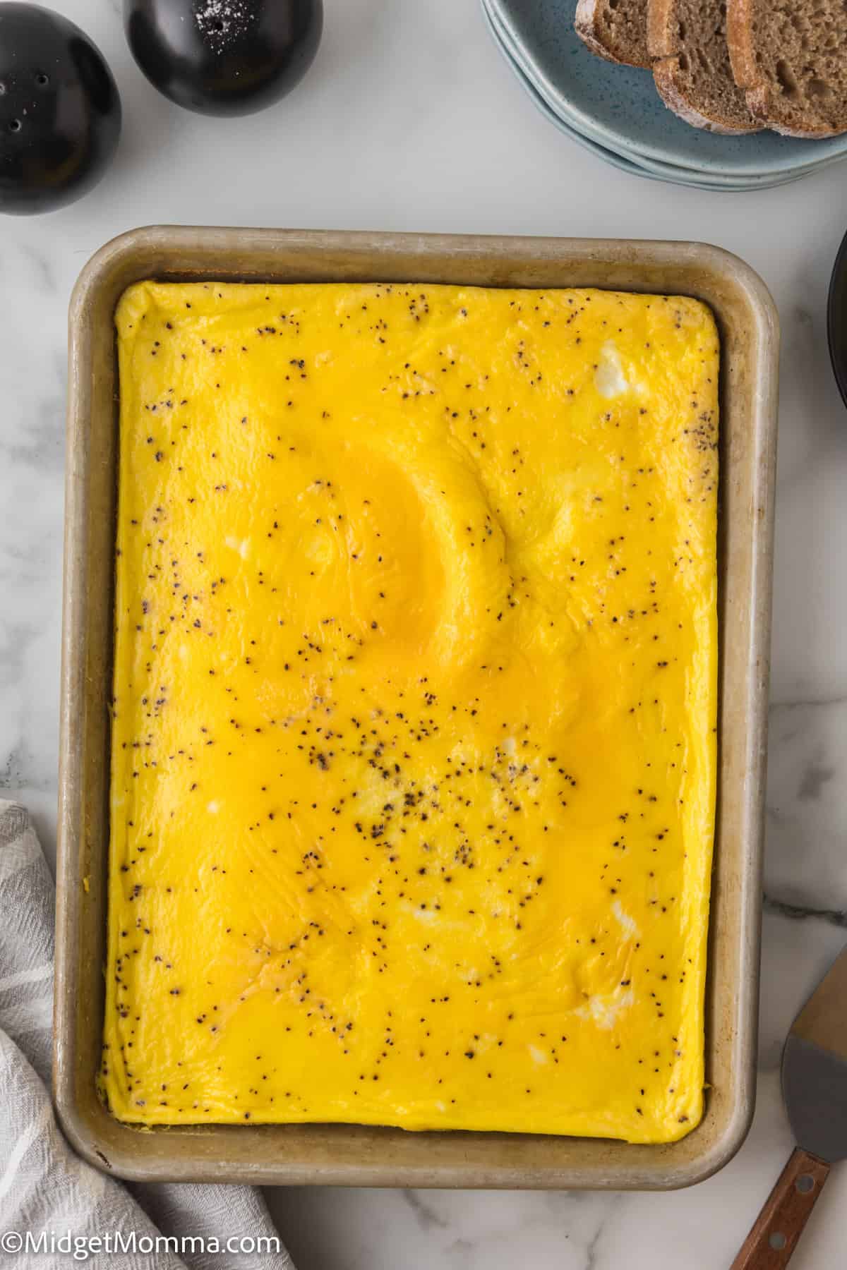 A rectangular baking dish with baked scrambled eggs.