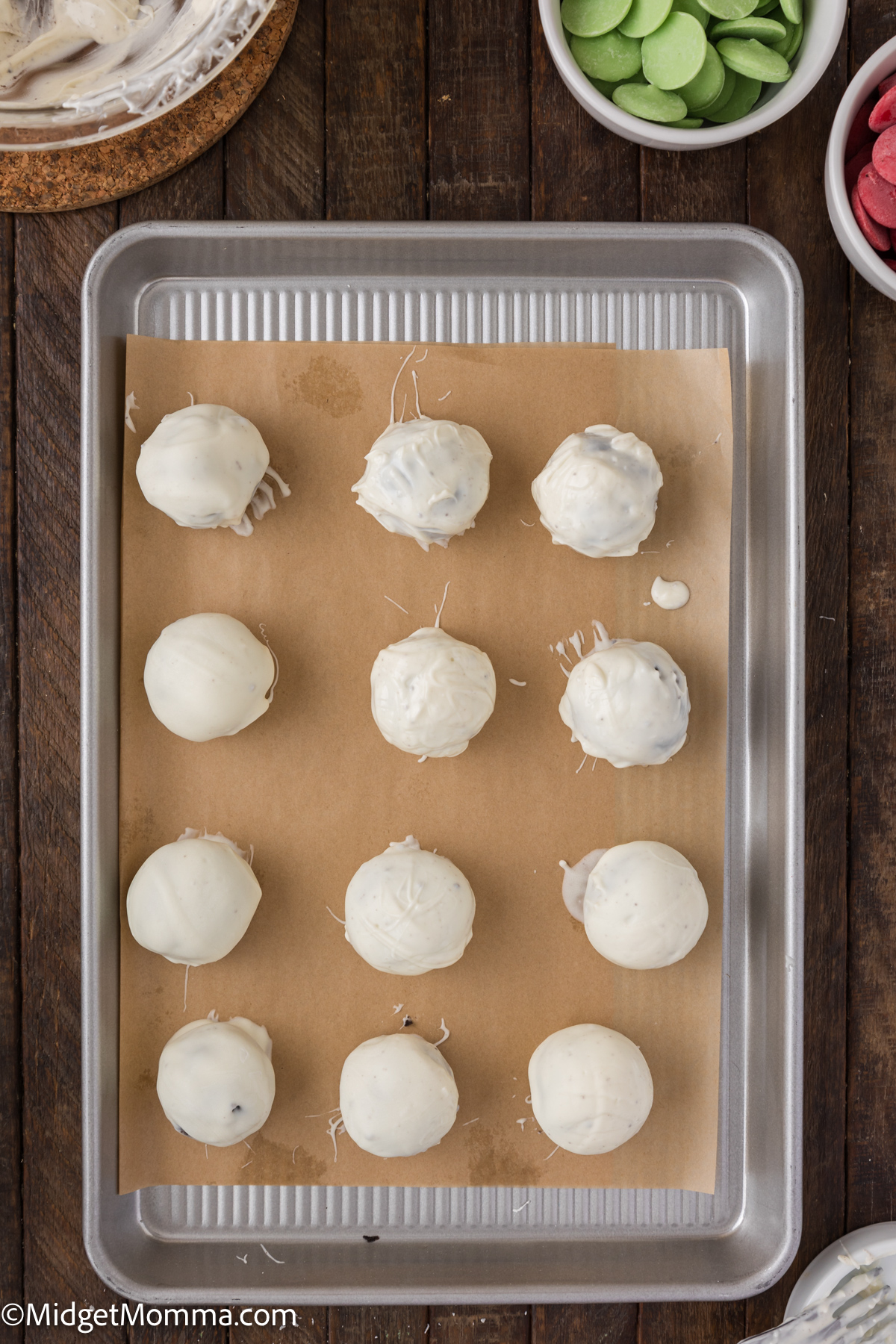 Chocolate covered Oreo Balls on a baking sheet