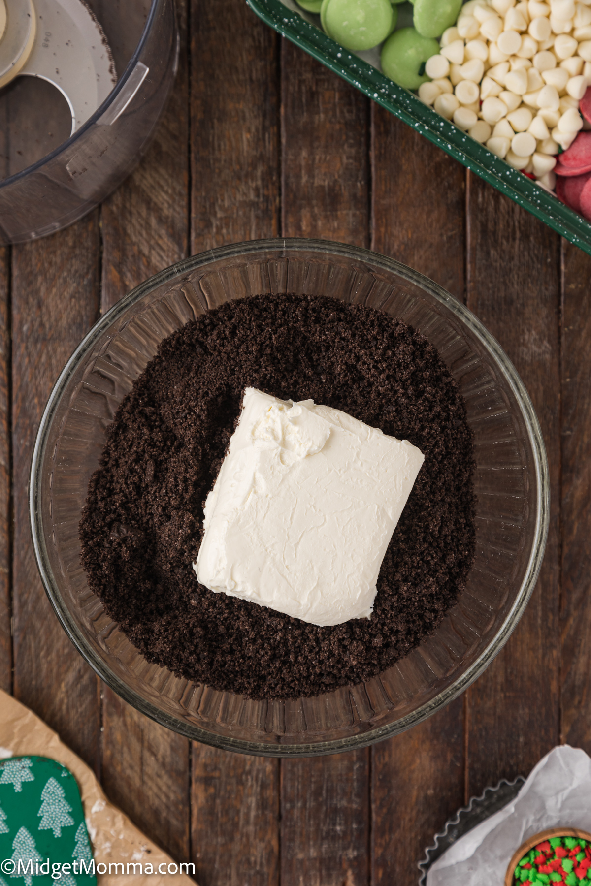 cream cheese in a food processor with oreo crumbs 